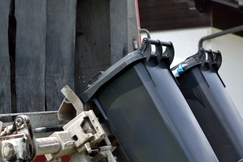 Professionals conducting flat clearance in a West London apartment